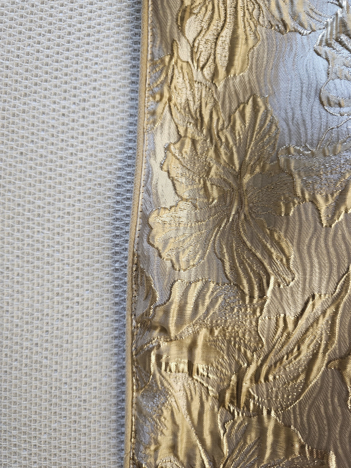 Bronzed Bloom challah cover shown over challah on the Shabbos table | MitzvahArt
