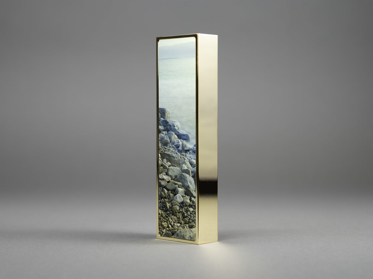 Tranquility Mezuzah in gold plate, mounted on a doorpost | MitzvahArt