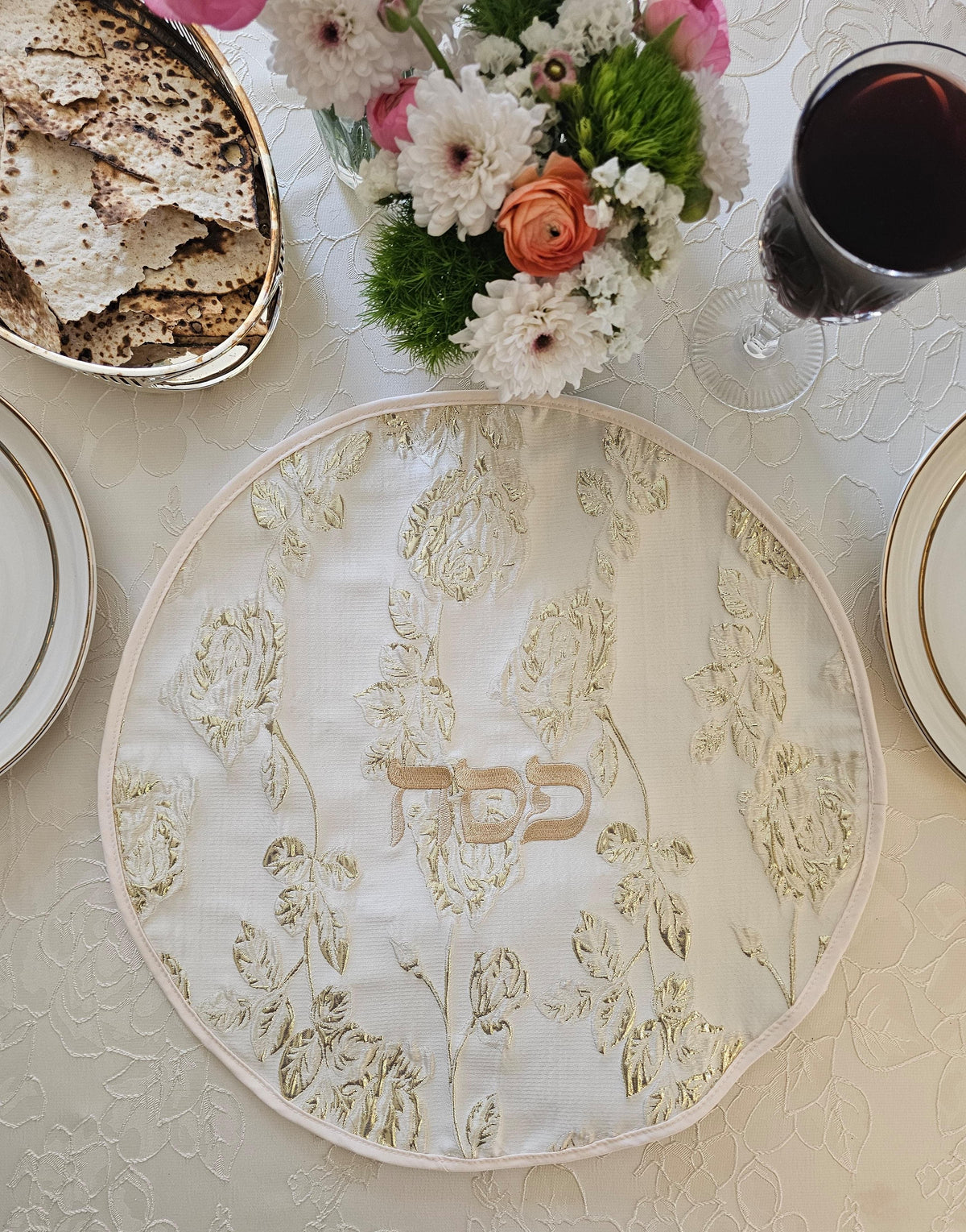 Rose Gold matzah set shown on the seder table | MitzvahArt
