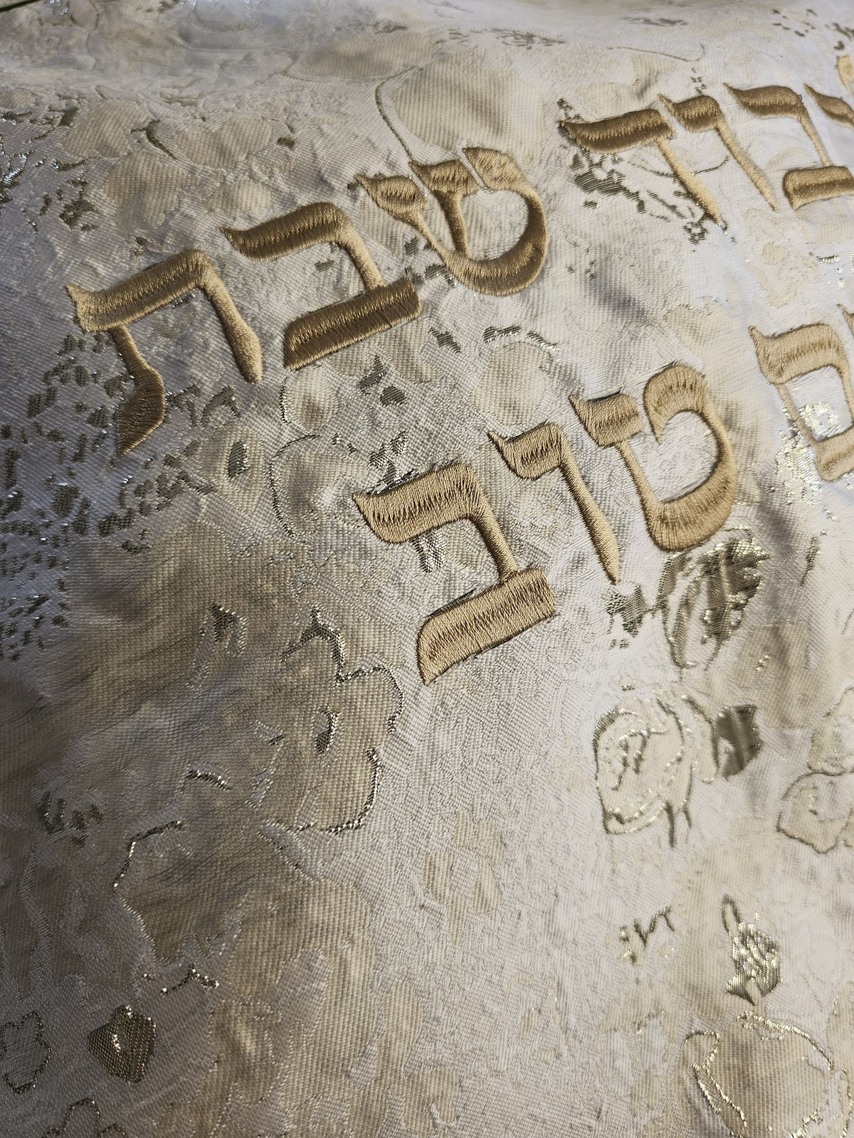 Olive Flowers challah cover on a set Shabbos table | MitzvahArt