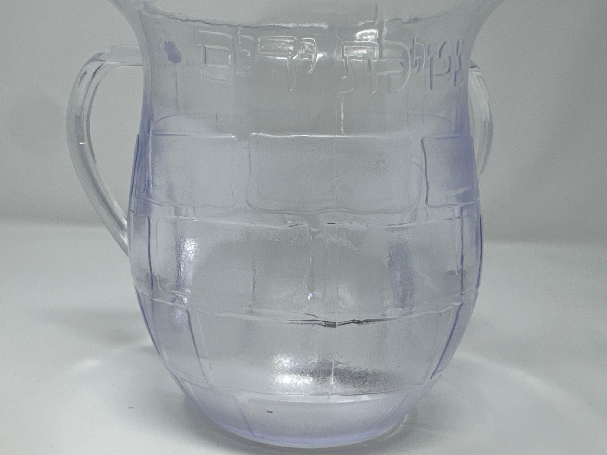 Close view of the moulded Kotel stonework on the washing cup | MitzvahArt