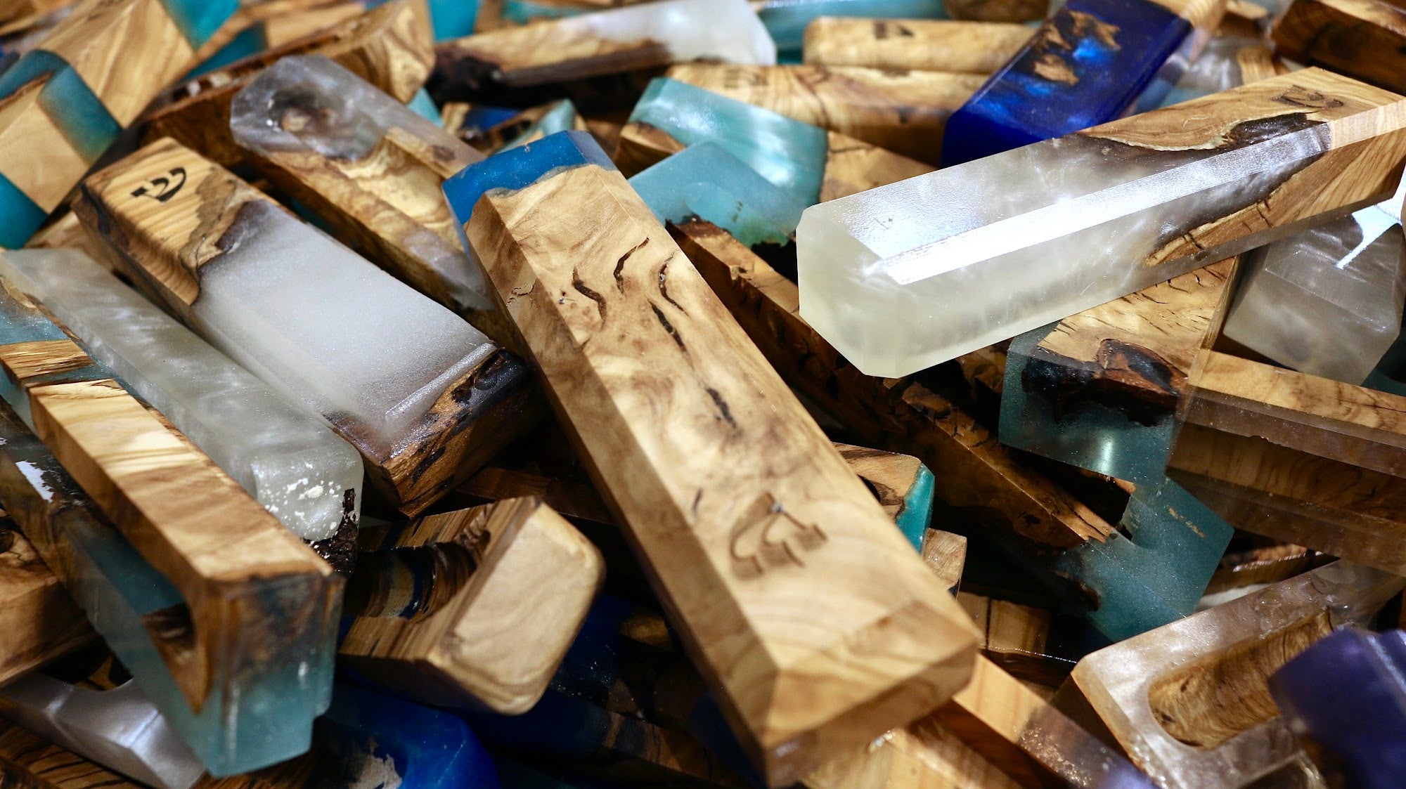 Collection of one-of-a-kind olive wood and resin mezuzah cases | MitzvahArt