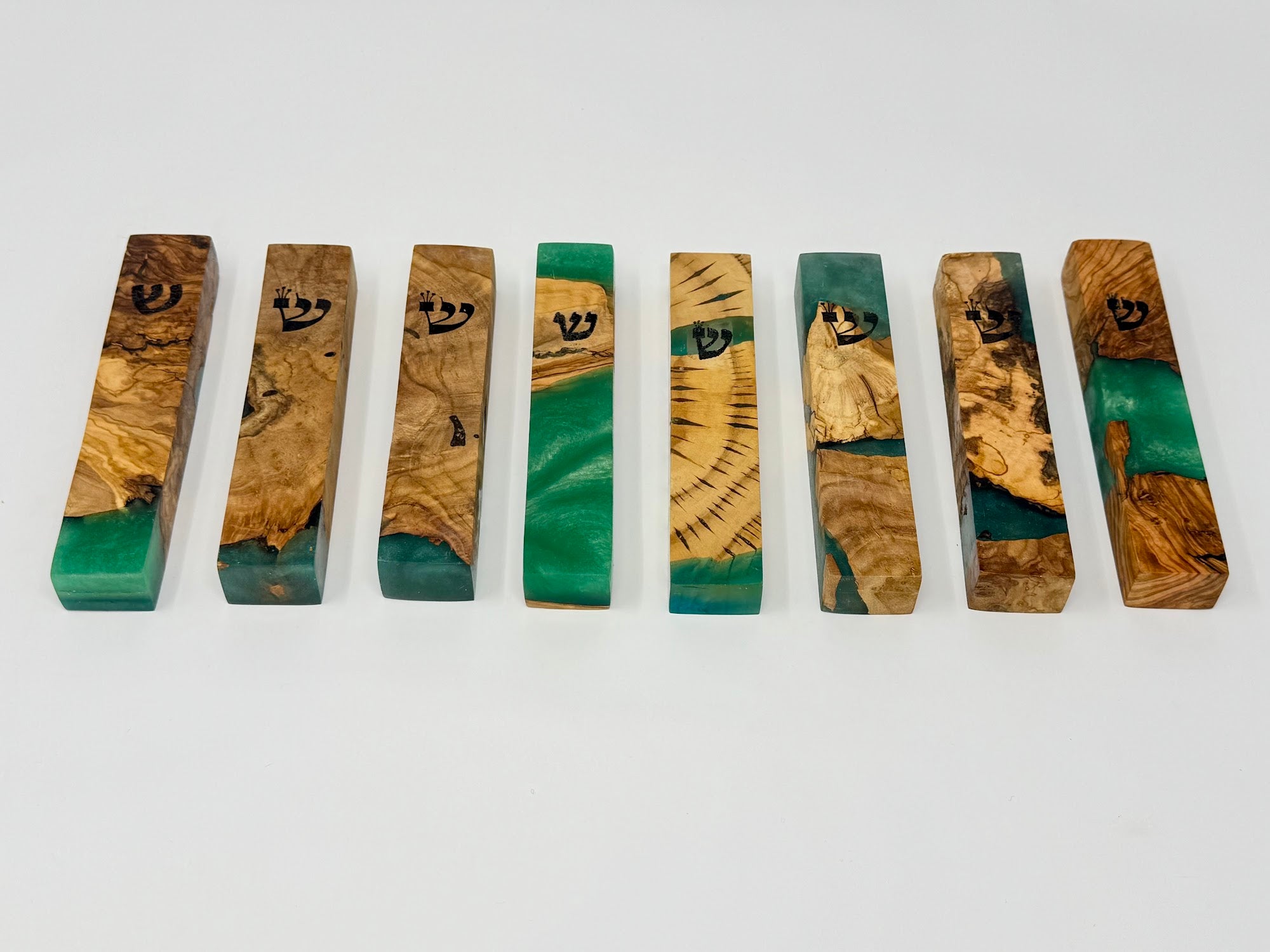 Green olive wood and resin mezuzah cases shown as a set, 12 cm | MitzvahArt