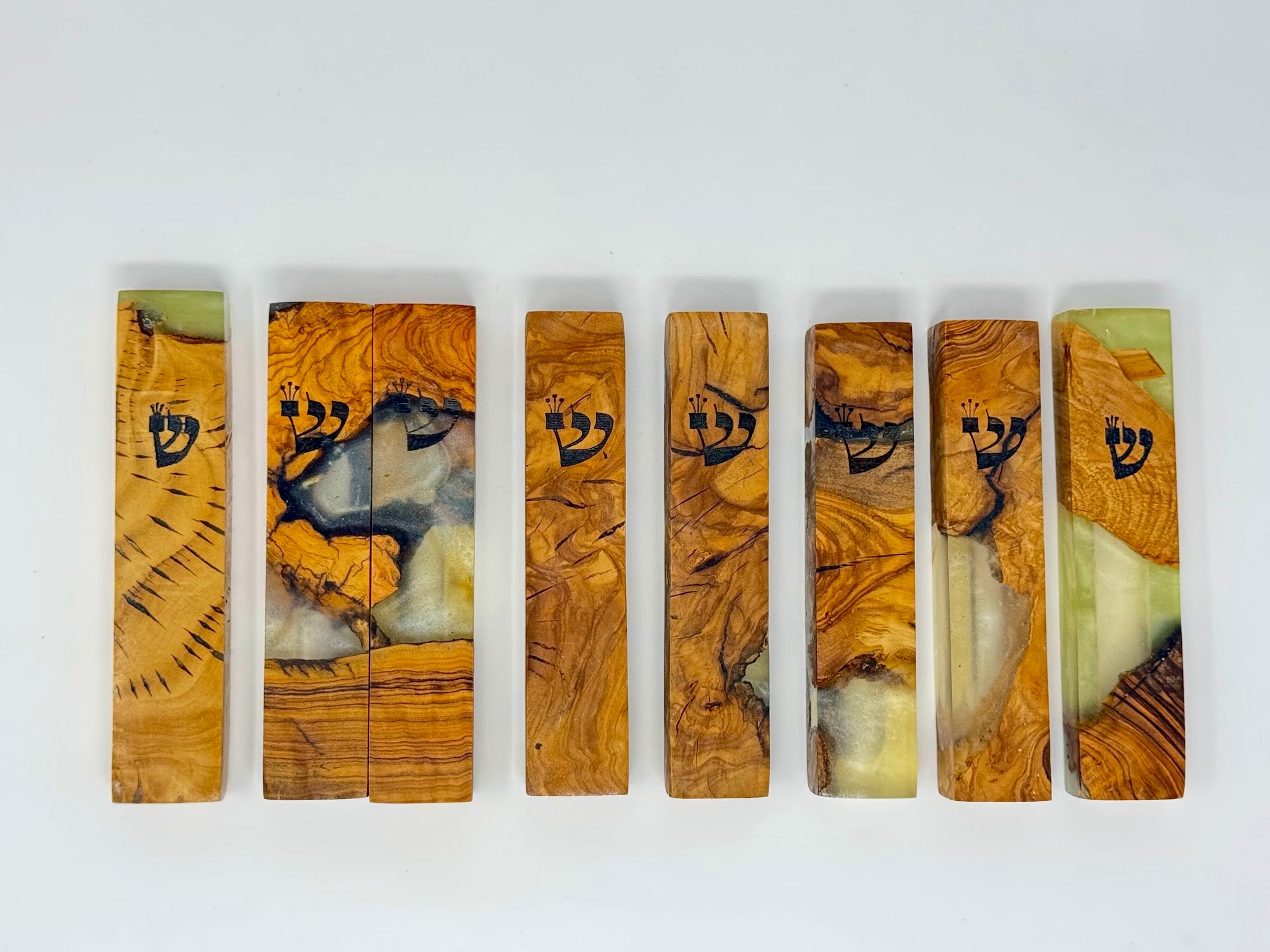 Clear and cream olive wood and resin mezuzah cases shown as a set, 12 cm | MitzvahArt