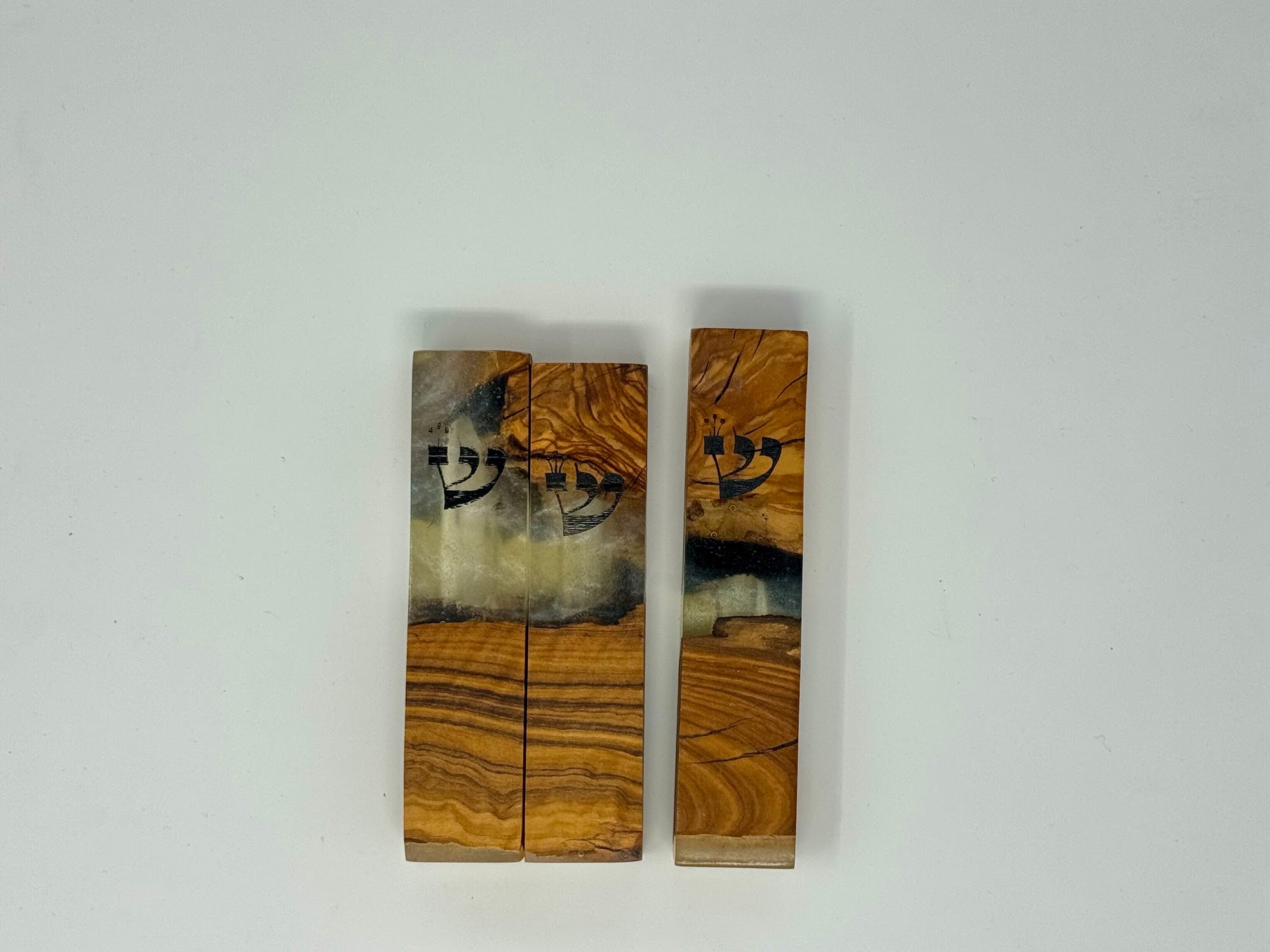 Clear and cream olive wood and resin mezuzah cases shown as a set, 10 cm | MitzvahArt