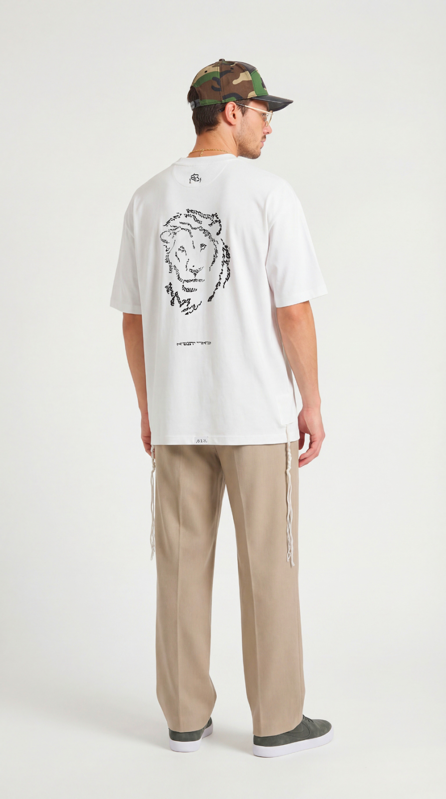 Lion's Rise tzitzit shirt in black - detail | 613 by MitzvahArt