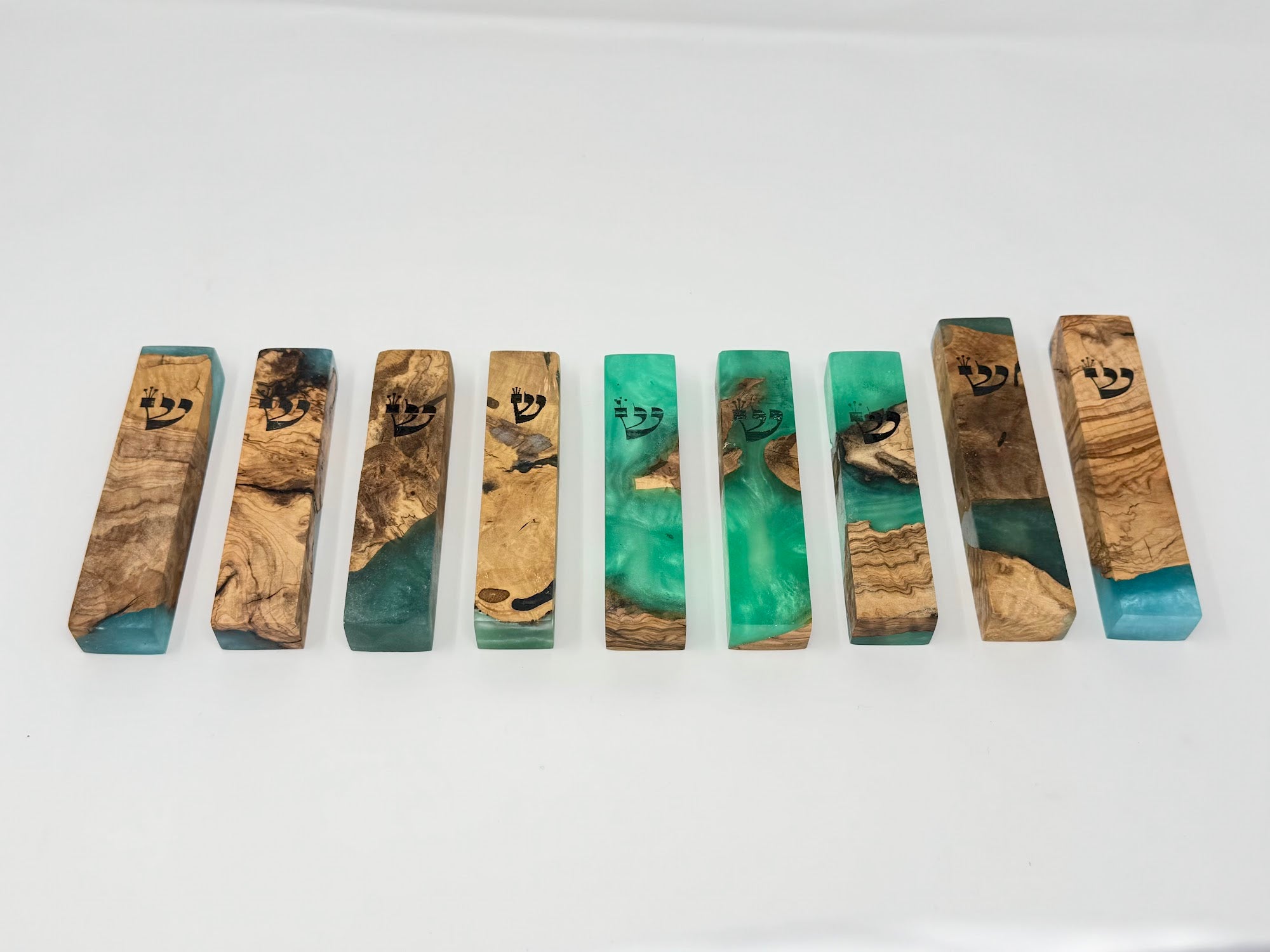 Green olive wood and resin mezuzah cases shown as a set, 10 cm | MitzvahArt