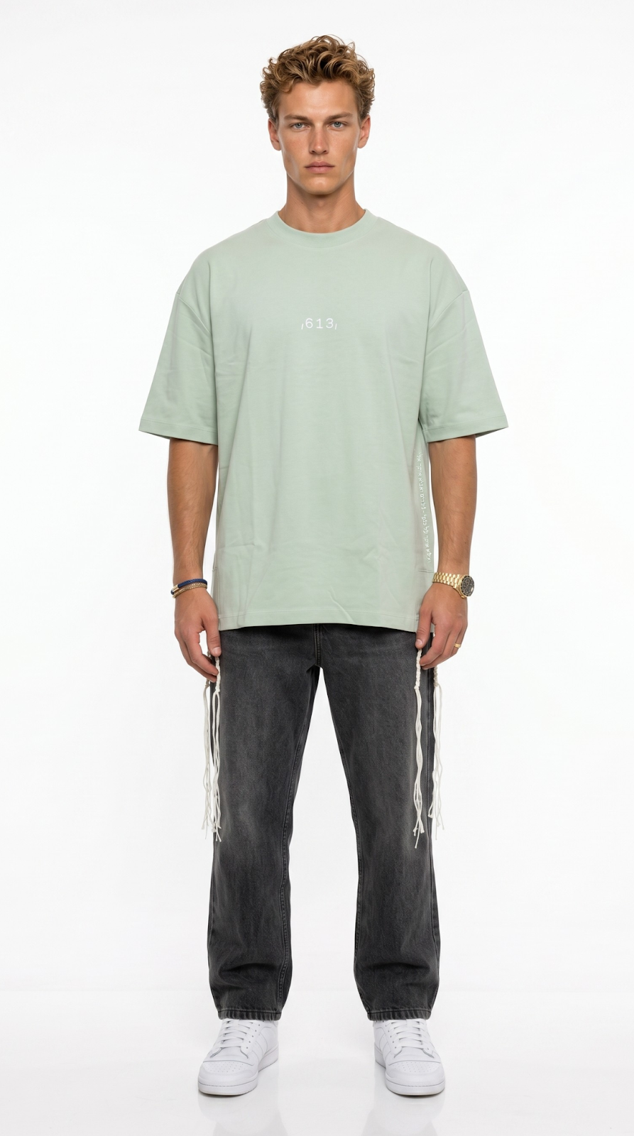 Wings of Vision tzitzit shirt in sage green, close up