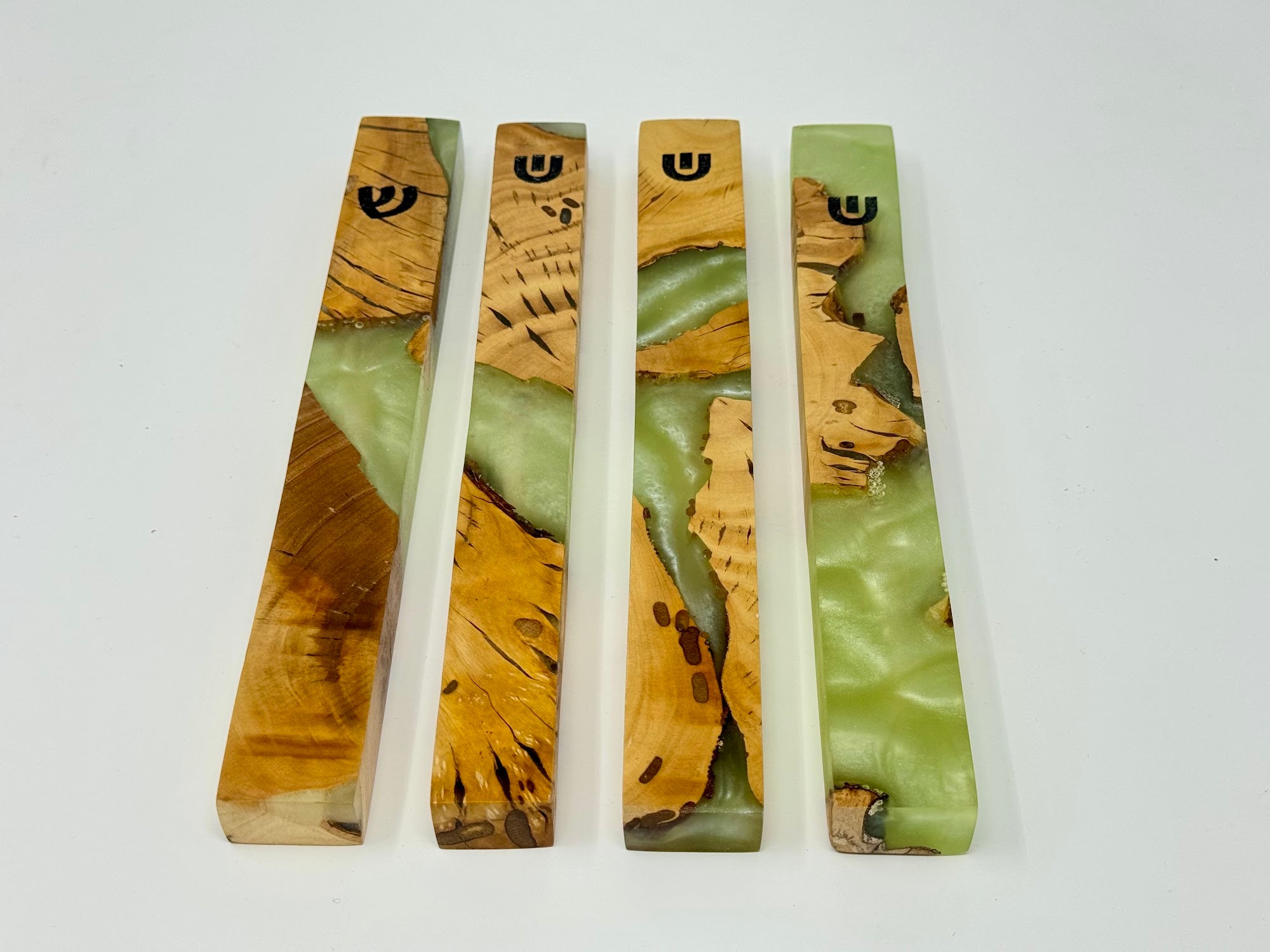 Light green and cream olive wood and resin mezuzah cases shown as a set, 15 cm | MitzvahArt