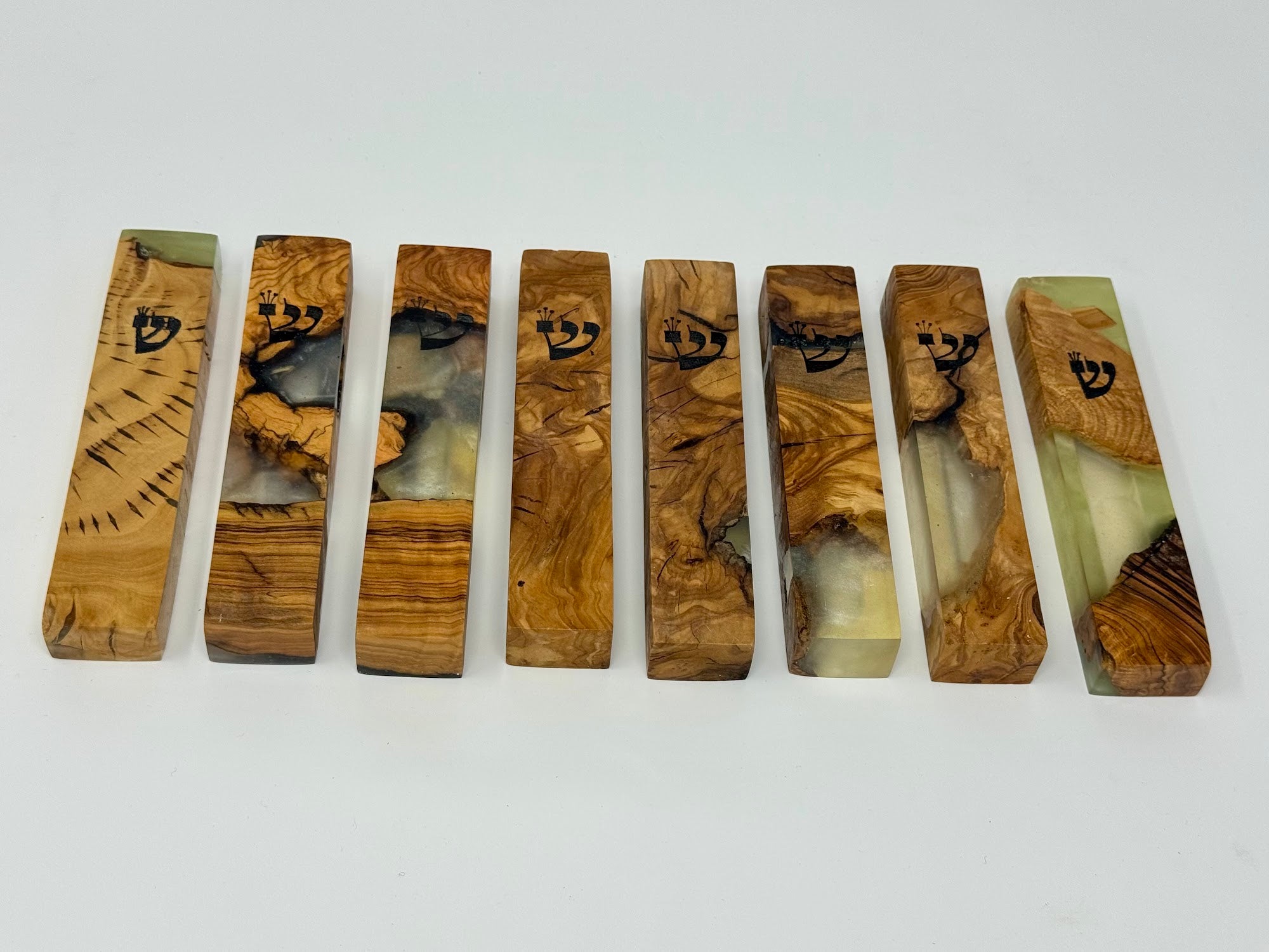 Clear and cream olive wood and resin mezuzah cases, angled view, 12 cm | MitzvahArt