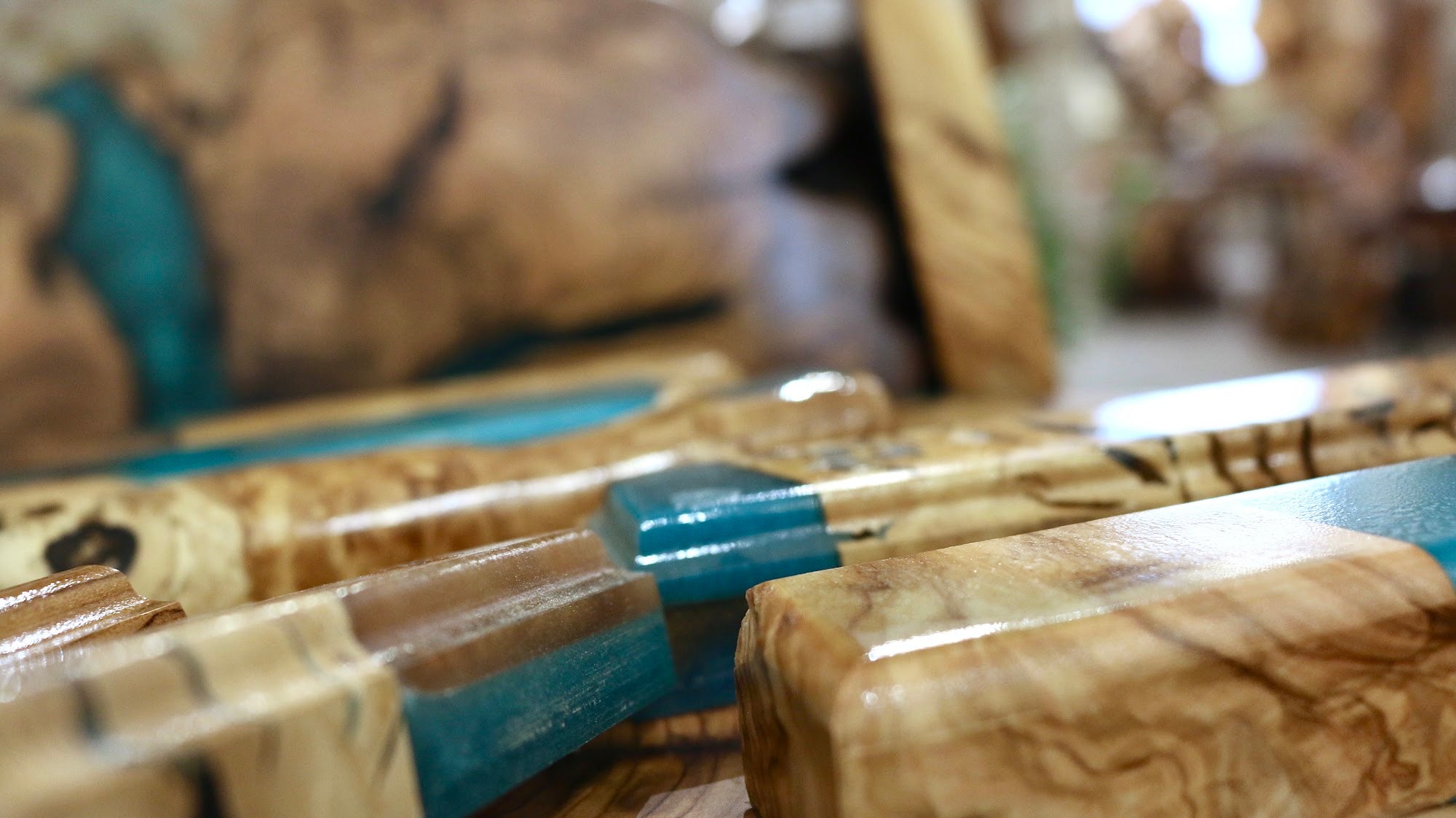 Detail of the polished resin edge on a handmade olive wood mezuzah case | MitzvahArt