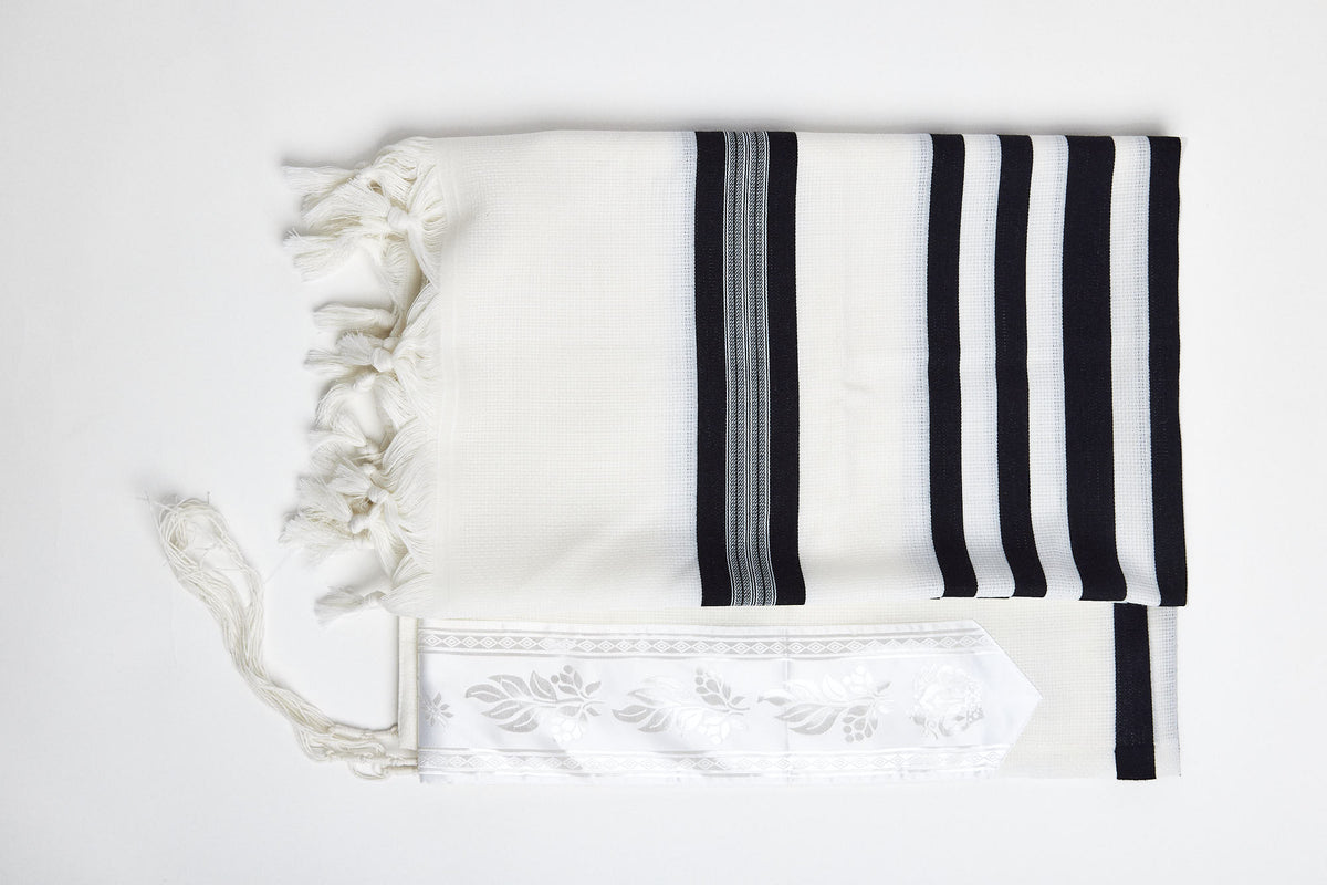 Mofet Lamenatzeach wool tallit draped over the shoulders | MitzvahArt
