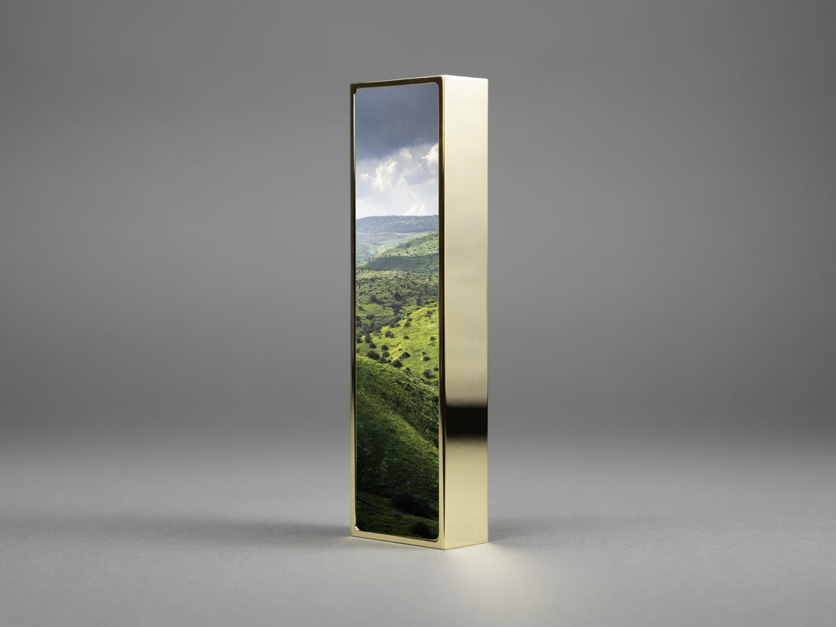 Hills of Arbel Mezuzah in gold plate, mounted on a doorpost | MitzvahArt